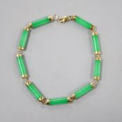A 585 yellow metal mounted jadeite bracelet, 19cm, gross 6.6 grams.CONDITION: Overall condition of