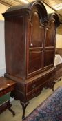 An early 18th century Dutch inlaid oak double dome top cabinet on stand, W.134cm, D.60cm, H.212cm