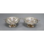 A pair of silver two handled bon bon dishes, with pierced gallery on circular bases, Birmingham