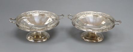 A pair of silver two handled bon bon dishes, with pierced gallery on circular bases, Birmingham