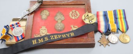 A Bosuns whistle, a 1st World War trio and 2nd World War Medals, badges etcCONDITION: Pte. G.