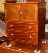 A Regency inlaid mahogany cabinet, fitted doors and two drawers, (formerly a commode chest), W.61cm