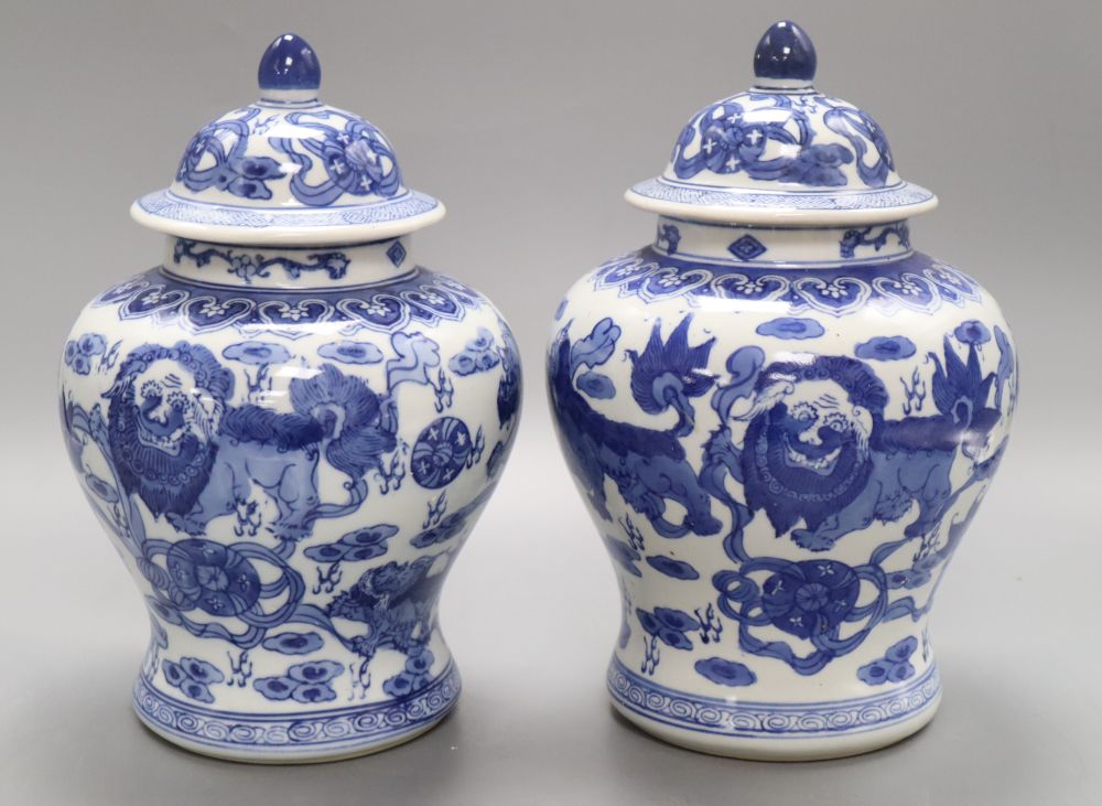 A pair of Chinese blue and white 'dragon' vases, height 26cmCONDITION: We believe these to be modern