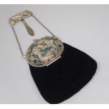 A late Victorian Art Nouveau silver mounted velvet evening purse, with suspension clip and chain,