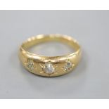 A Victorian 18ct gold and gypsy set three stone diamond ring, size O, gross 5.7 grams.CONDITION: