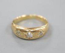 A Victorian 18ct gold and gypsy set three stone diamond ring, size O, gross 5.7 grams.CONDITION: