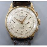 A gentleman's 18k Delrio chronograph manual wind wrist watch. case diameter 38mm, gross 45.9 grams.