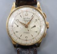 A gentleman's 18k Delrio chronograph manual wind wrist watch. case diameter 38mm, gross 45.9 grams.