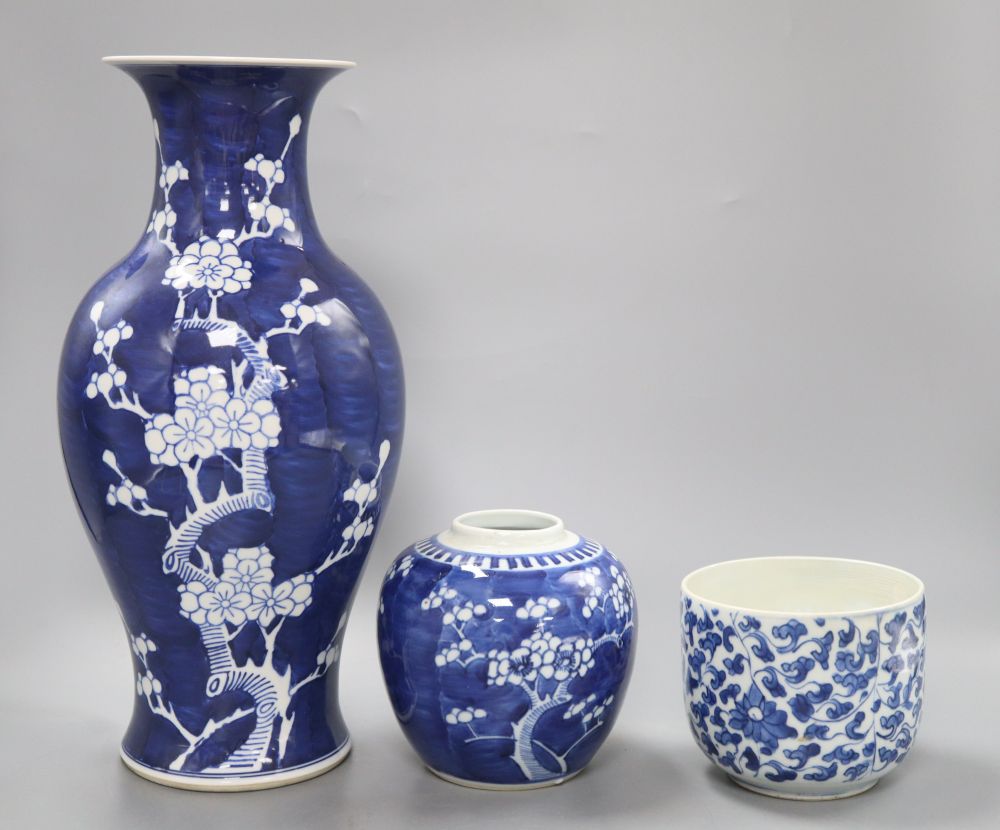 A Chinese blue and white 'prunus' vase, height 36.5cm, jar and a kangxi blue and white jar (