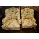 A pair of Victorian floral-covered easy chairs