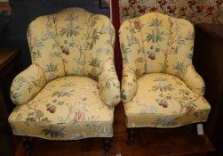 A pair of Victorian floral-covered easy chairs