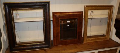 A walnut and parcel-gilt picture frame, a giltwood and gesso picture frame and a laburnum oyster