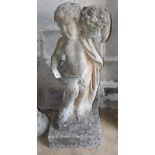 A reconstituted stone garden ornament, putto with a basket of flowers, H.90cm