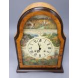 A Victorian style maple mantel clock