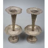 A pair of early 20th century Indian pierced white metal spill vases with drip pans?, 22.2cm,