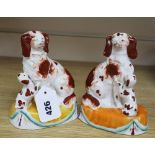 A pair of Staffordshire Spaniels, height 16cm