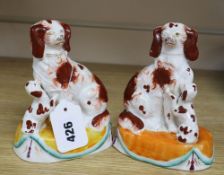 A pair of Staffordshire Spaniels, height 16cm