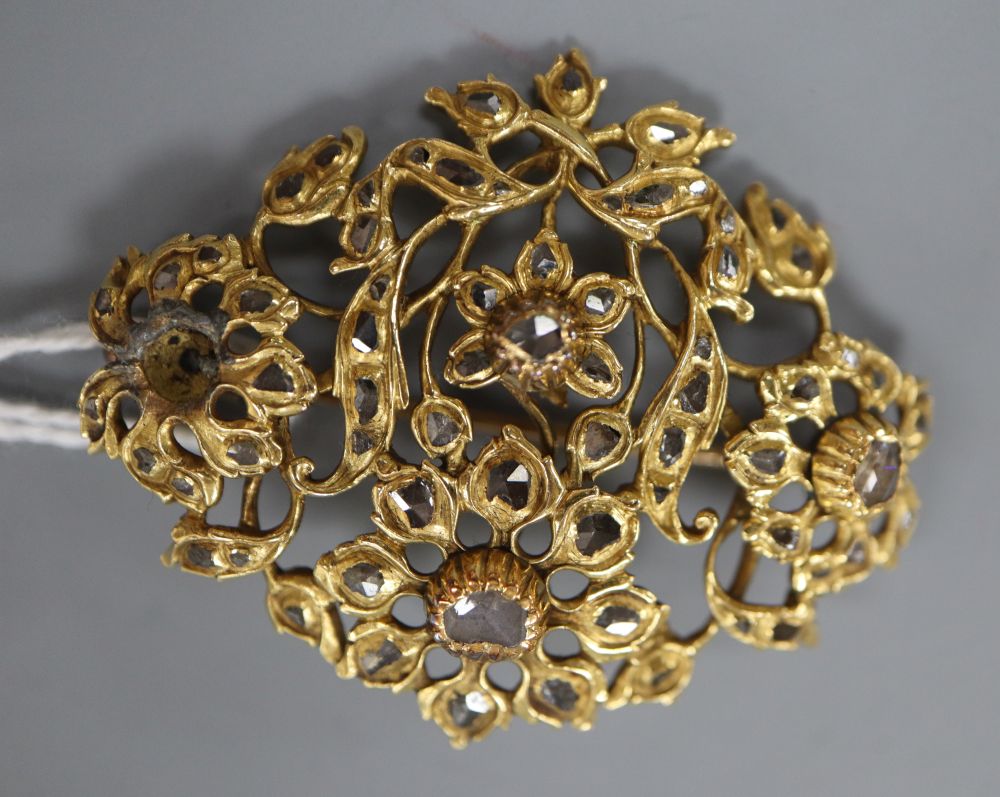 A continental yellow metal and rose cut diamond set foliate pendant brooch,(lead solder repair