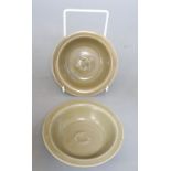 A pair of Chinese celadon 'twin fish' small dishes, diameter 12cm, with associated certificates
