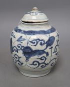 A Chinese Late Ming blue and white 'lion and lotus' jar and cover, overall height 17.5cm, restored