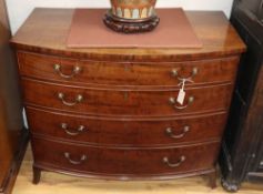 A George III mahogany bowfront chest of four long drawers, W.107cm, D.68cm, H.90cm