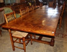 A 17th century style pollard oak extending refectory-style table, 330cm extended (two spare leaves),