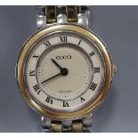 A lady's modern stainless steel and yellow metal Gucci quartz wrist watch, with original receipt and