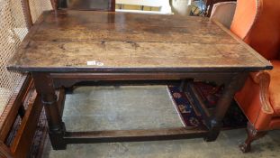 A small late 17th century and later oak refectory table, on gun barrel supports with all round