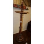 A Victorian carved walnut candlestand with mid tier, H.90cm