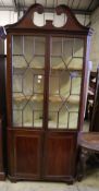 A George III mahogany standing corner display cabinet