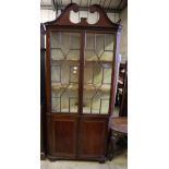 A George III mahogany standing corner display cabinet