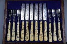 A cased set of twelve pairs of Victorian shibayama handled silver dessert eaters, Martin, Hall & Co,