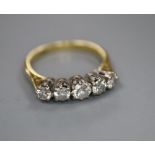 An 18ct and graduated five stone diamond set half hoop ring, size O, gross 3.6 grams.CONDITION: No