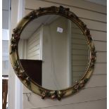 A circular floral moulded mirror, 68cm diameter