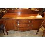 A 1920's Chippendale revival mahogany bow fronted sideboard, W.152cm, D.60cm, H.115cm