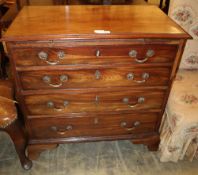 A small George III mahogany chest with brushing slide, four graduated drawers, on later ogee bracket