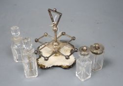 A stylish Victorian silver cruet stand, by Hukin and Heath, Birmingham, 1885, with four matching