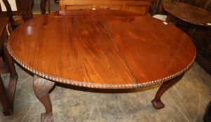 A 1920's Chippendale revival mahogany extending dining table, 210cm extended (two leaves and