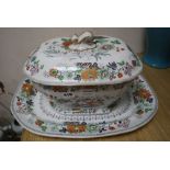 A Davenport stone china soup tureen and cover and a meat platter, printed and painted with