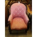 A Victorian carved frame spoon-back armchair