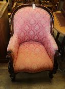 A Victorian carved frame spoon-back armchair