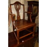 A George III provinical oak elbow chair