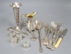 Assorted silver including a Victorian silver cream jug, silver posy vase, four silver napkin