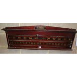 An early 20th century mahogany wall hanging snooker scoreboard by Mortloch, London, W.106m, H.38cm