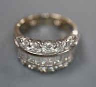 A modern 18ct white gold and three row baguette and round cut diamond set dress ring, by Picchiotti,