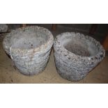 A pair of circular reconstituted stone brick effect garden planters, 28cm diameter, H.24cm