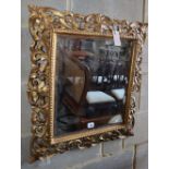 A Florentine style carved giltwood wall mirror (a.f.), W.60cm, H.66cm