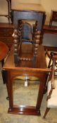 A small oak gateleg table, 80cm extended, W.72cm, H.70cm and a mahogany-framed wall mirror