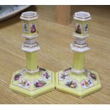 A pair of Berlin yellow ground porcelain candlesticks, height 14cm