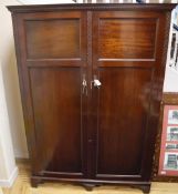 A 1920's mahogany compactum wardrobe, W.132cm, D.52cm, H.182cm